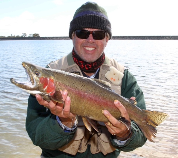 Fisho writer Greg Finney with a typical fly-caught Thompson Creek Dam rainbow.